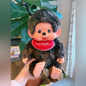 Large Monchhichi boy doll in sitting position